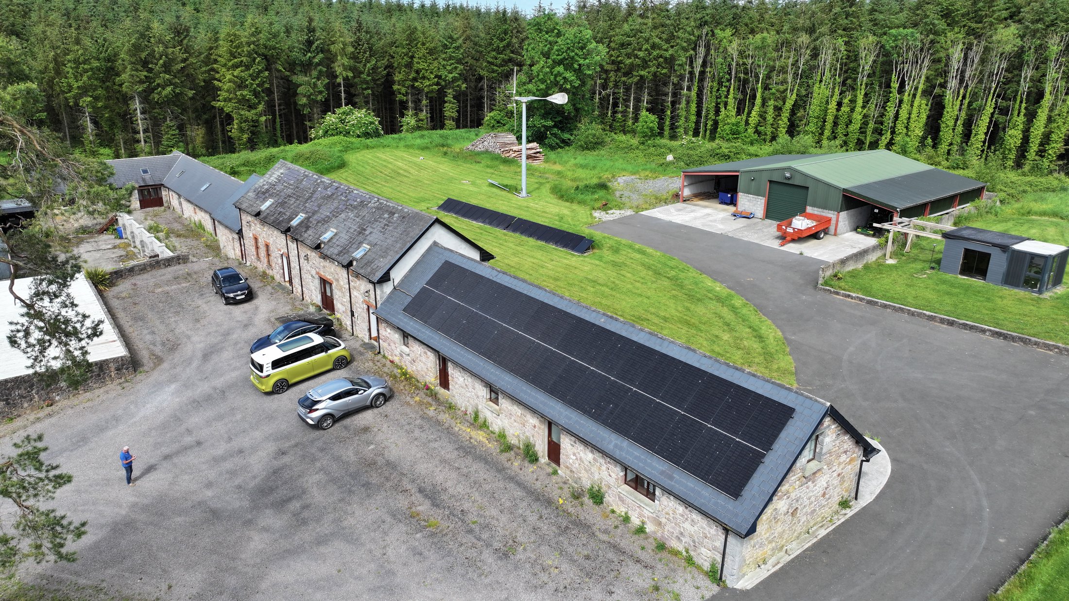 The main office building with its full-roof solar PV array